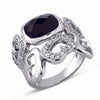 STERLING SILVER RING WITH MULTI-FACETED BLACK CENTER AND CLEAR CZ STONES